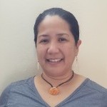 photo of Leiana San Agustin Naholowaʻa wearing a t-shirt, necklace, and hair pulled back