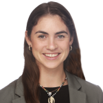 Headshot of Monica Steffey, from the collar bone up, a white woman with long brown hair, with a soft smile. 