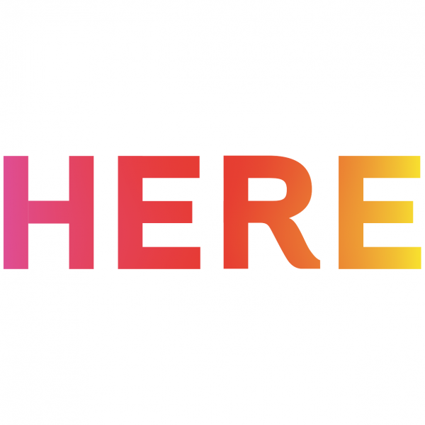 Gradient pink, orange, and yellow letters on white background spelling out HERE. 