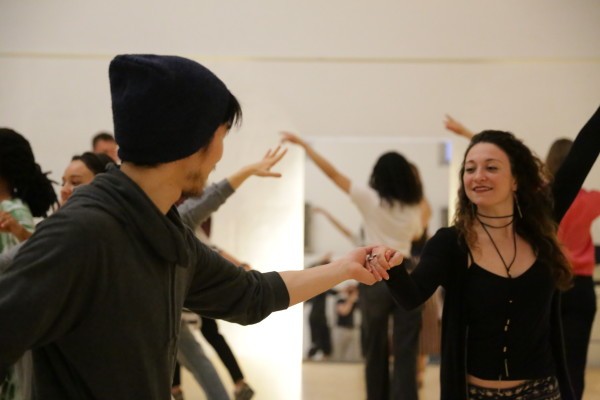 Two dancers enjoy the Hustle.