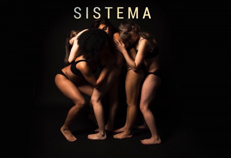 Curet Performance Project leans on another in a group with eyes closed.