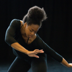 An American Dance Festival student dancing in a studio
