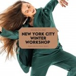 Photo of Nicole von Arx dancing in a dark green outfit.