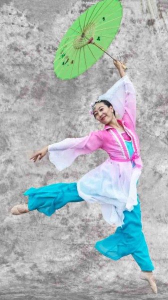 Guest Teacher Kerry Lee: Chinese classical dancer wearing light pink, white & baby blue watercolor costume with green umbrella.