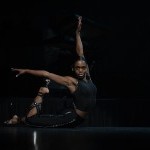 Solo dancer wearing all black on stage