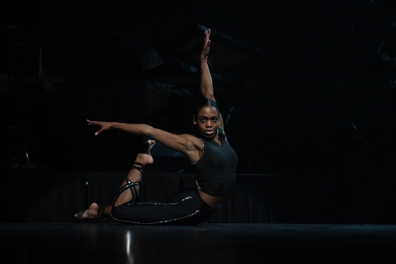 Solo dancer wearing all black on stage