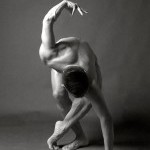A black and white image of Peter in an S-shape dance pose. 