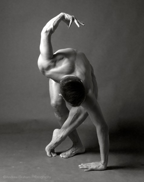 A black and white image of Peter in an S-shape dance pose. 