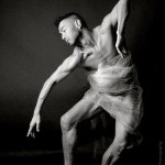 Photo of an Asian male dancer in black and white posing.