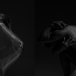 Two dancers side by side, shadowed in silhouette 