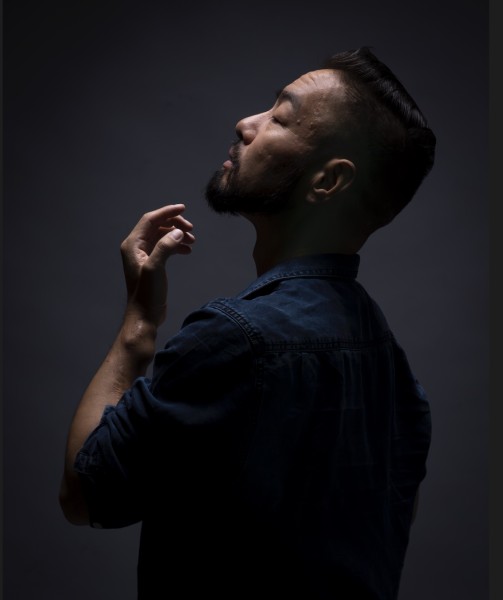 Side profile of Peter Cheng, dancer.