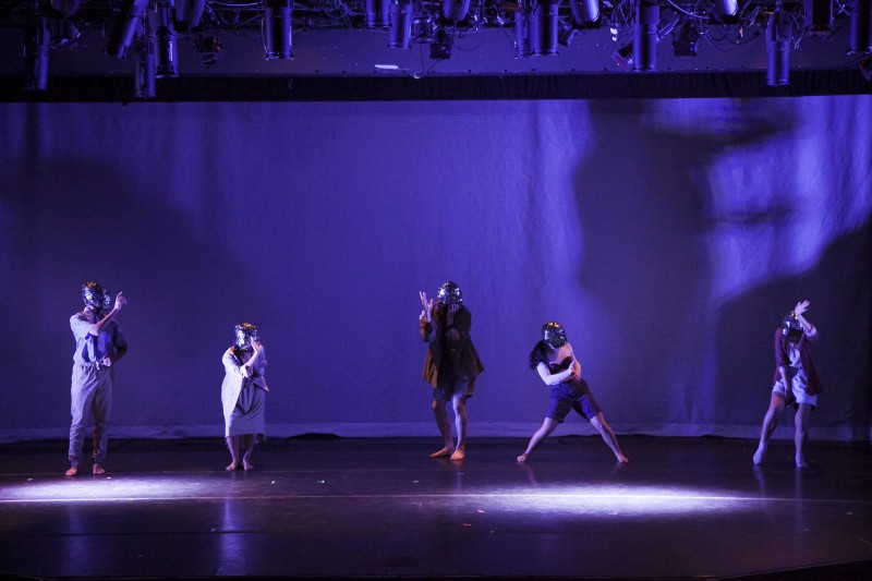 Photo of Dis-Configure. Features 5 dancers on stage wearing sequined masked from the Emerging Choreographer Series