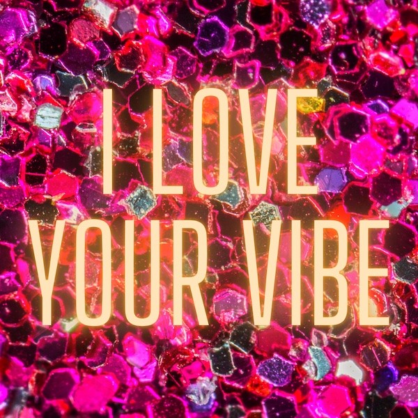 Yellow glowing text reading "I love your vibe" sits on top of a hot pink glittering background.