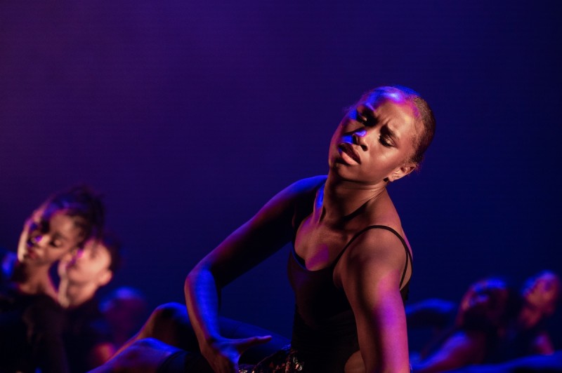 Woman dancer with head tilted slightly back, three-quarter facing viewer
