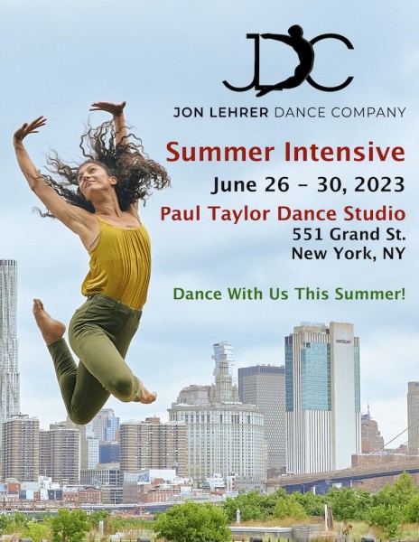 Woman jumping in front of skyline