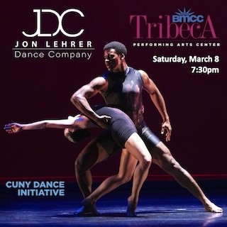 Two dancers partnering with one holding the other in an arch.