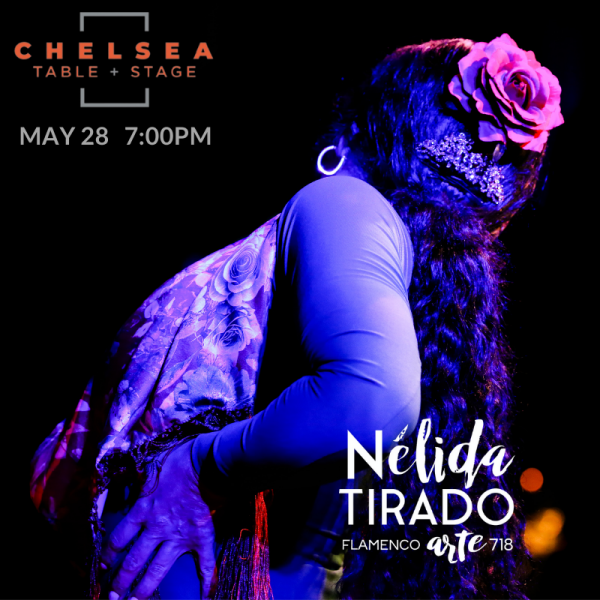 Back of woman with flower in her pulled back ponytail on black background