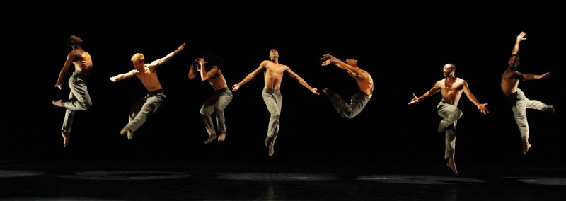7 dancers leaping in dark brown Ted Shawn pants