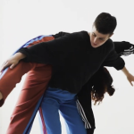 One dancer supporting another on their back