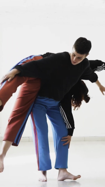 One dancer supporting another on their back