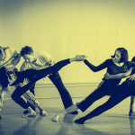 five dancers from Stephen Petronio dance company in blue and yellow duotone, with two leaning left, two leaning right, one in md