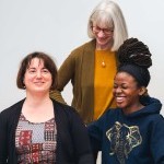 Teacher guiding students as they smile and laugh