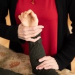 AT Teacher supports the weight of student's arm