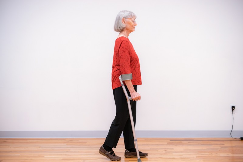 Ann Rodiger is walking with a mobility aid in a Hip Health Workshop