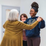 Students smile while working on Alexander Technique