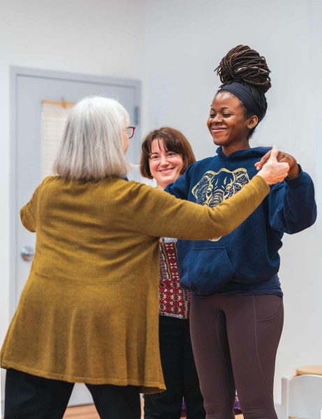 Students smile while working on Alexander Technique