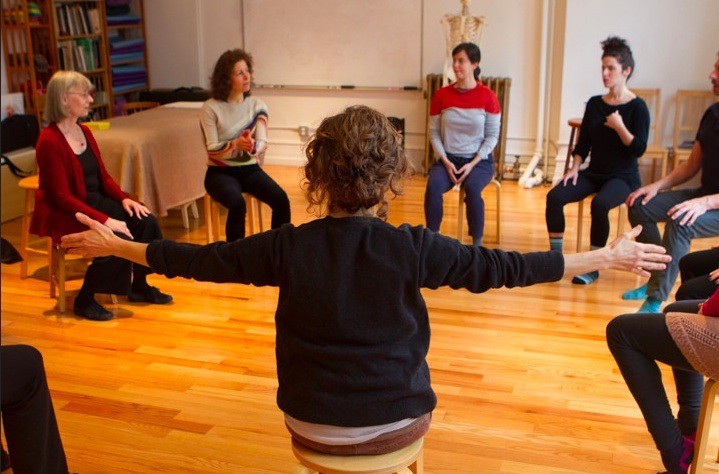An image of participants seated in a circle from a BAC Training Course Open House