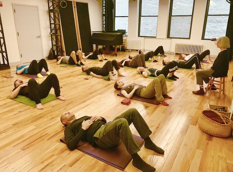 Ann Rodiger teaching a floor class to a group of students at the Balance Arts Center