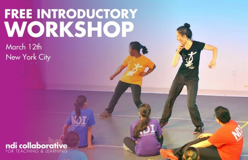 A teacher and a student dancing together in front of a group of students