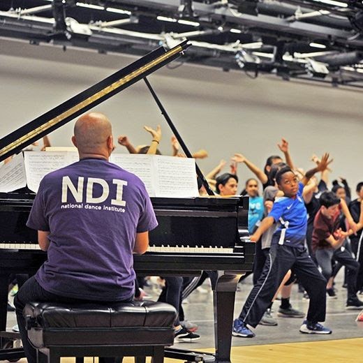 NDI Musician on the piano and children dancing