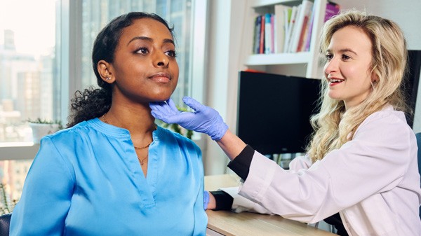 Woman getting voice examined
