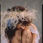 fine art example - gaia, girl with a crown of flowers woven in hair rest her head on her knees covered in dirt. Pensive express