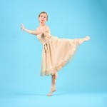 Dancer in attitude and 1920s frilled dress.