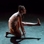 balancing on knee and foot, with leg extended out front, nevada sings an offering 