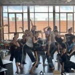 dancers from the last series of Body in Play gather for a mirror selfie. Funny faces, sweat, and good vibes abound.