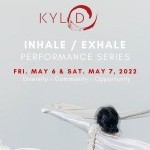 Dancer in white tossing fabric