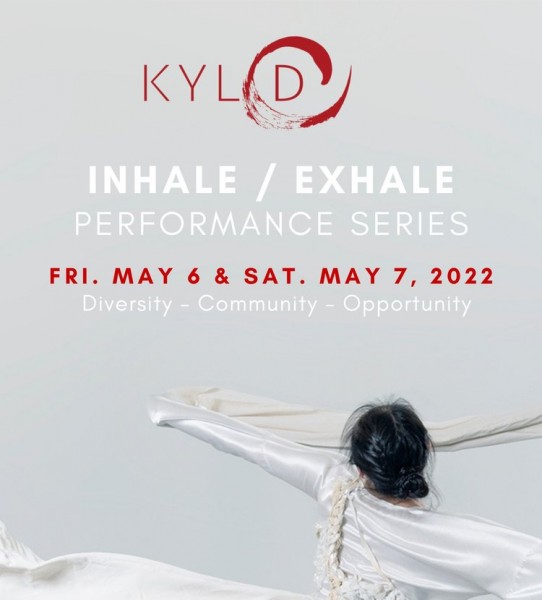 Dancer in white tossing fabric