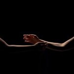 Arms reaching for each other