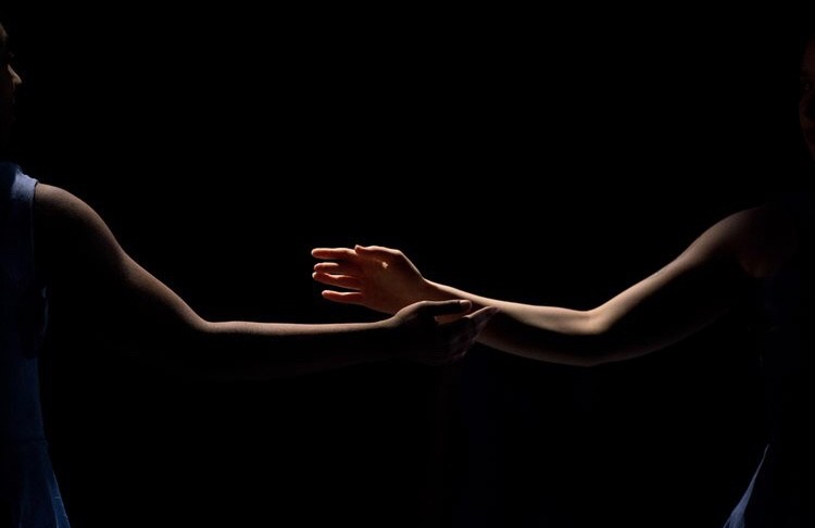 Arms reaching for each other 