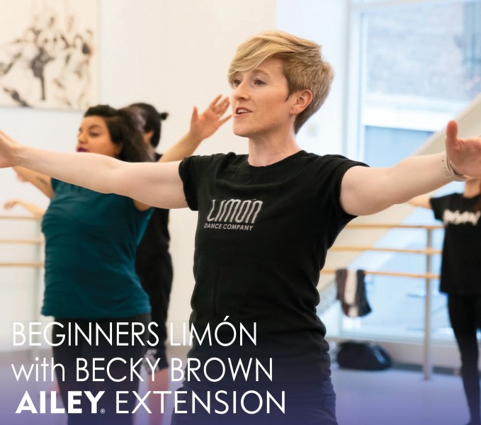 Becky Brown teaching in the Ailey studios with students reaching arms out to the side