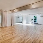 Our large, bright, studio space. The studio is appx. 900Sqft, has a wall of mirrors that can be closed with a curtain and a wall