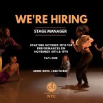 A group of dancers on stage form a circle with one dancer in the middle