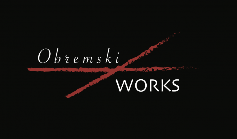 Obremski/Works Logo with a red cross in between "Obremski" and "Works" in front of a black backdrop