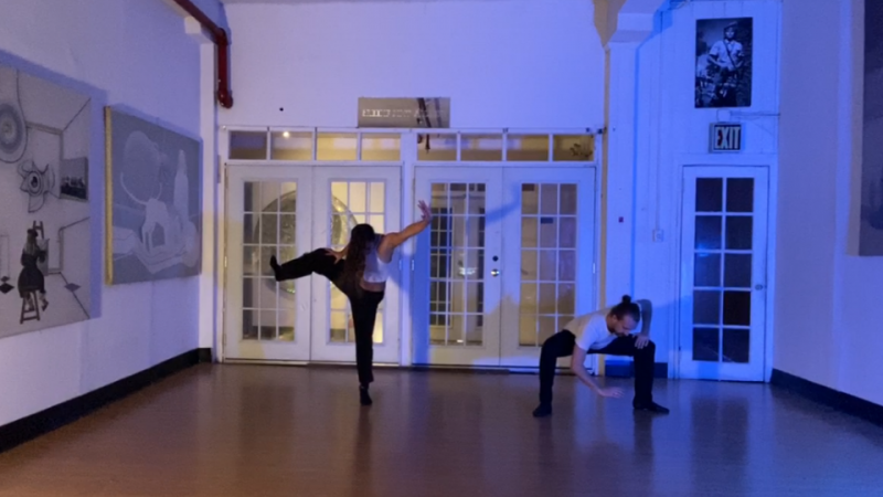 Image of two dancers in a studio 