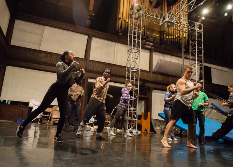 A group of dancers rehearse in a former Sunday School wing of an active church. An organ can be seen on the balcony