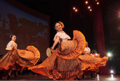 dancer with traditional Mexican dress and flowers in hair